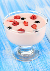 Delicious yogurt with fruit on table close-up