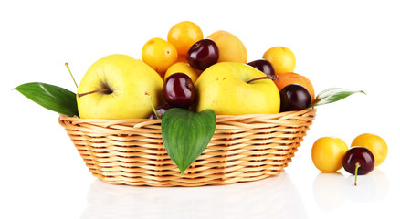 Bright summer fruits in basket isolated on white