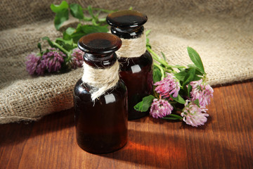 Medicine bottles with clover flowers