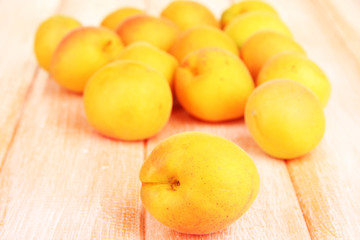 Fresh natural apricot on wooden table