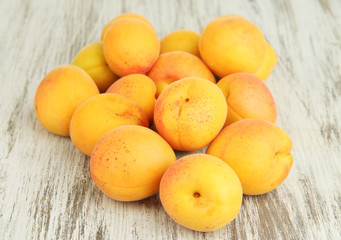Fresh natural apricot on wooden table close up