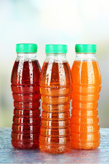 Assortment of bottles with tasty fruit juices