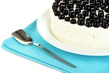 Cheesecake with fresh berries on white plate closeup