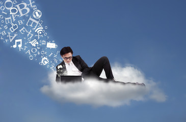 Fototapeta premium Asian businessman working on cloud with flying alphabet