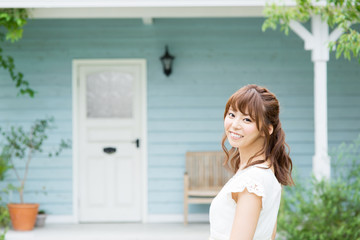 Beautiful young woman relaxing in garden