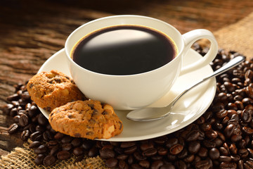 Coffee cup with cookies and fresh coffee beans
