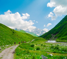 Fototapeta na wymiar Young hikers trekking in Svaneti