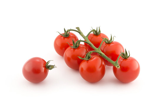 Cluster of cherry tomatoes on the white isolated background