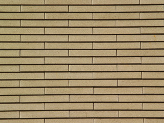 Wall with light brown bricks texture