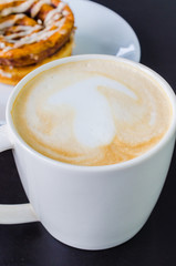 Latte on the black table
