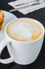 Latte on the black table