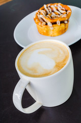 Latte on the black table