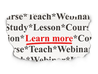 Education concept: Learn More on Paper background