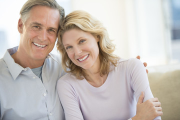 Couple Smiling Together At Home