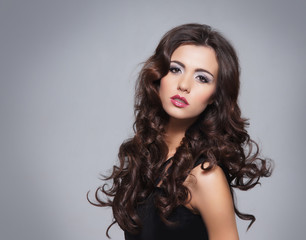 Beauty portrait of a young brunette woman in makeup