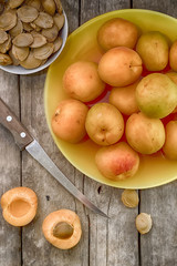 Ripe apricot on a wooden background