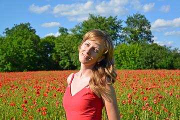 Portrait of the girl in a poppy field