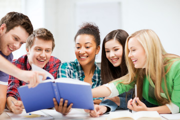 students reading book at school