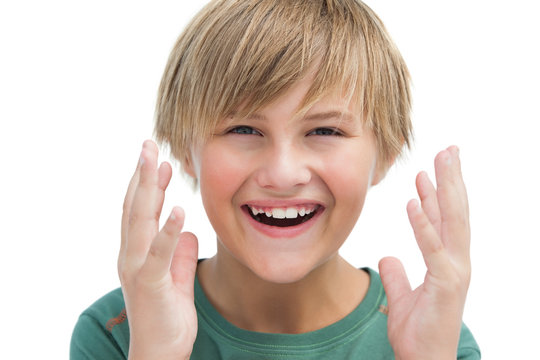 Suprised Blonde Boy With Hands Up Smiling