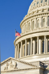 Obraz premium United States Capitol Building dome detail and national flag - Washington D.C. United States of America