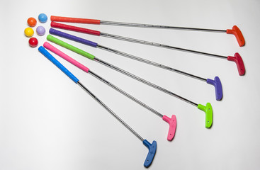 Brightly colored Mini Golf Clubs and Balls