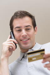 Man paying with credit card on  phone