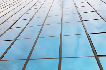 background of blue sky reflect on glasses from  business buildin