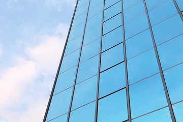 Fototapeta na wymiar background of blue sky reflect on glasses from business buildin