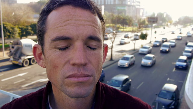man tries to shut out the noisy city