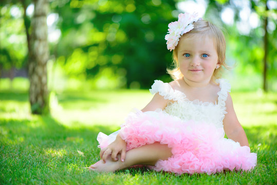 Cute Little Girl In Tutu At Park