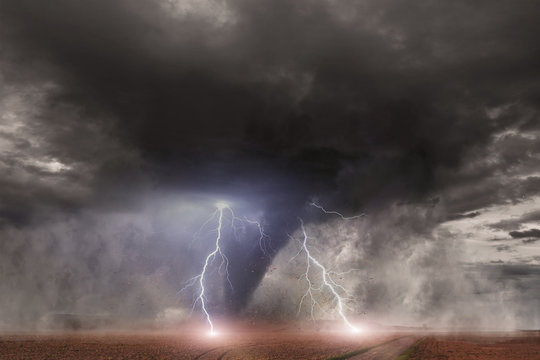 Tornado with lightning over a field