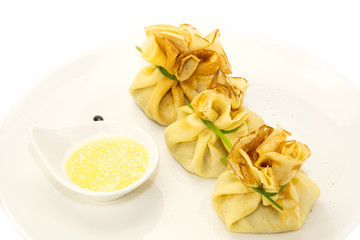 pancakes with meat on a table in a restaurant