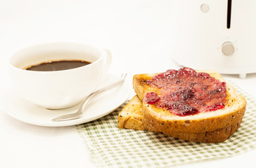 Toasted bread and toaster for breakfast.