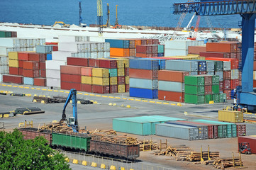 Cargo container, lumber and train in port Odessa, Ukraine