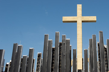 Gold cross in a blue sky