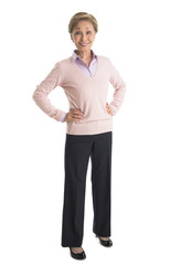 Portrait Of Confident Businesswoman Standing With Hands On Hips