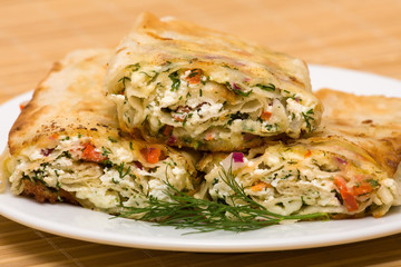 Pita bread wrapped with cottage cheese and vegetables