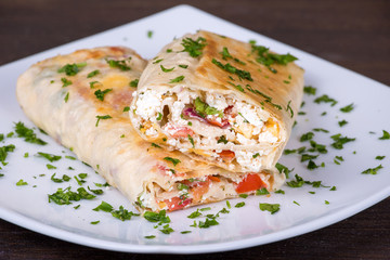 Pita bread wrapped with cottage cheese and vegetables