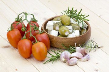 feta cheese with olives, tomatoes, garlic and herbs