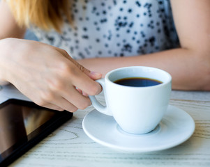 businesswoman  in a cafe drinking coffee