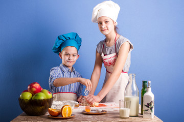 children knead the dough