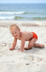 cute boy having fun on beach