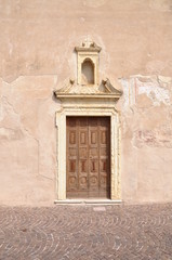 Church door with decorative portal Bardolino, Italy