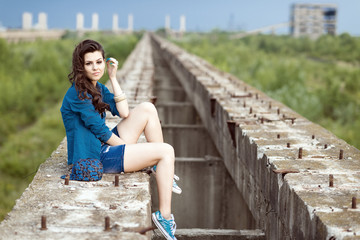 Young woman fashion in a ruined building.