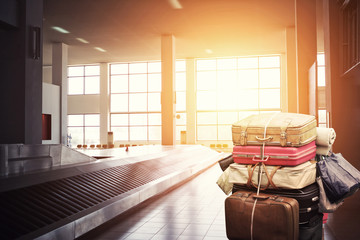 Many suitcases and bags on a cart