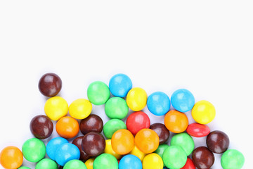 Fototapeta na wymiar Chocolate balls in colorful glaze are bottom.