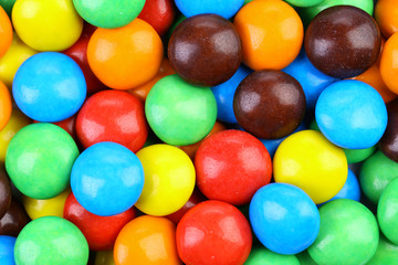 Fototapeta na wymiar Backgroynd of chocolate balls in colorful glaze.