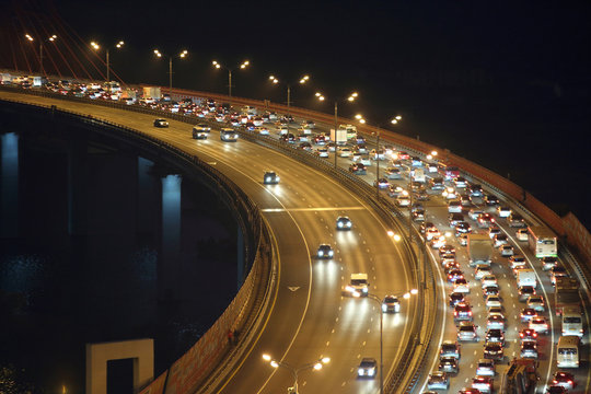 Night traffic on highway with motion cars