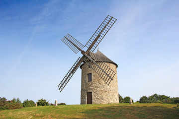 Fototapeta na wymiar Old traditional windmill in Normandy, France