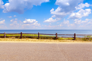 Beautiful coast road with cloudy sky - Powered by Adobe